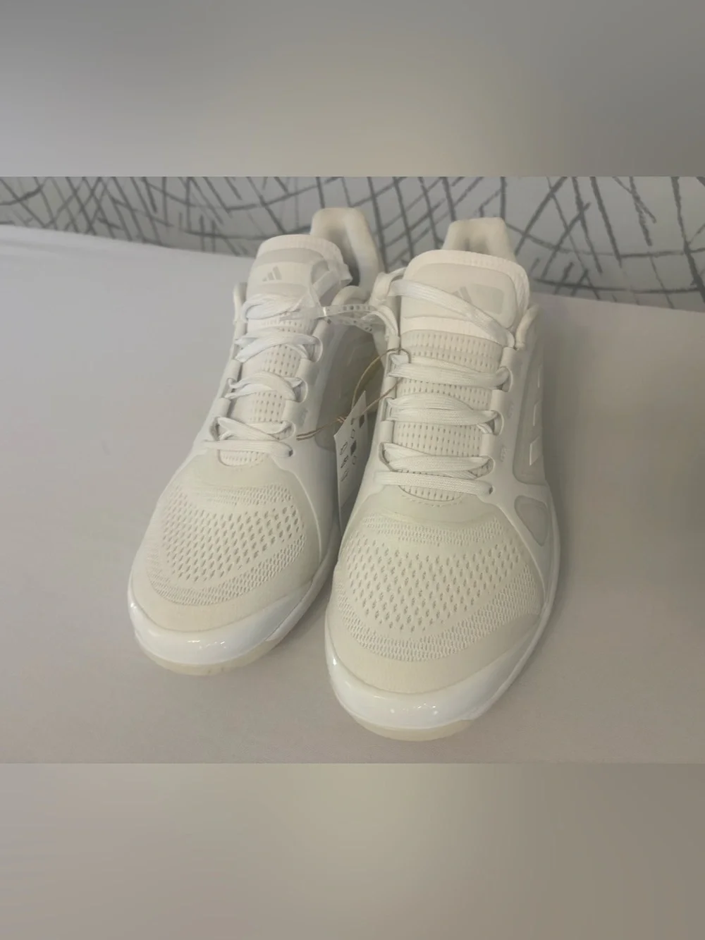 adidas Avaluxe tennis shoes in white with subtle pastel yellow accents. JQ7080